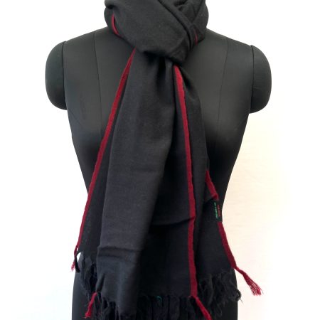 Handwoven merino wool stole in black with a thin red selvedge