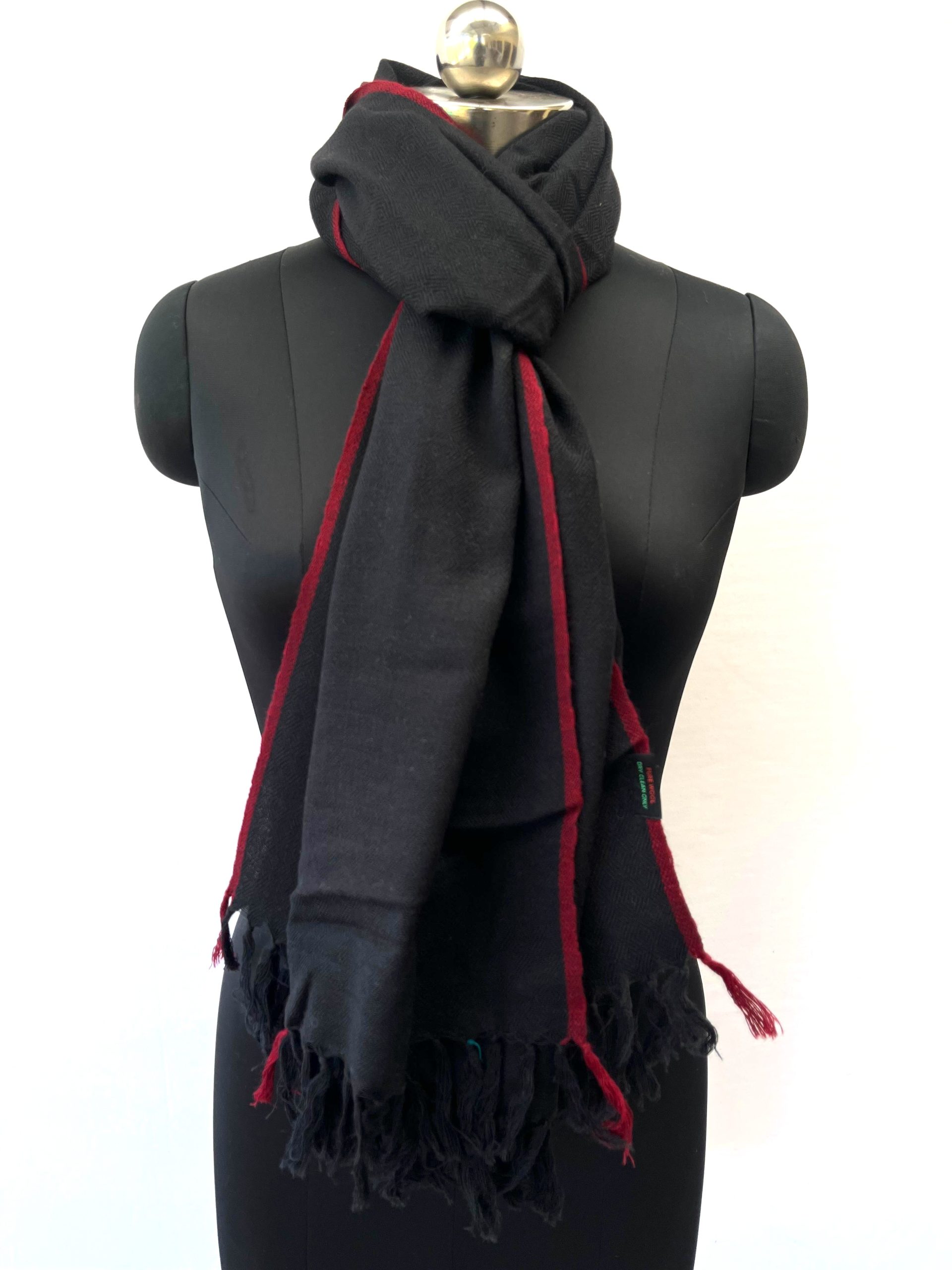 Handwoven merino wool stole in black with a thin red selvedge