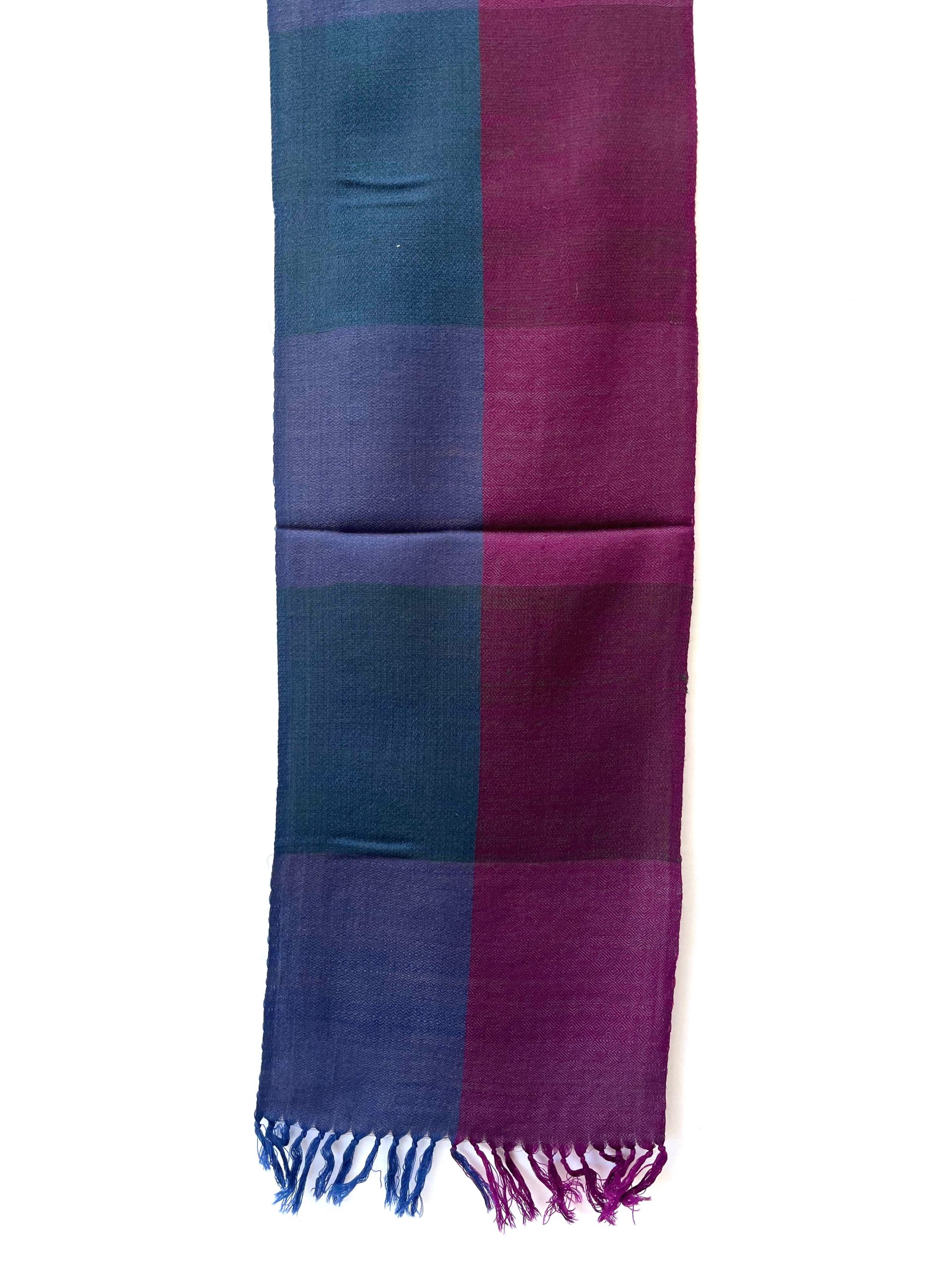 Handwoven merino wool scarf in large checks in teal, purple, wine and magenta. All with a hint of royal blue.