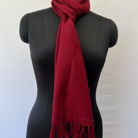 Classic red merino wool, handwoven scarf, knotted on a mannequin