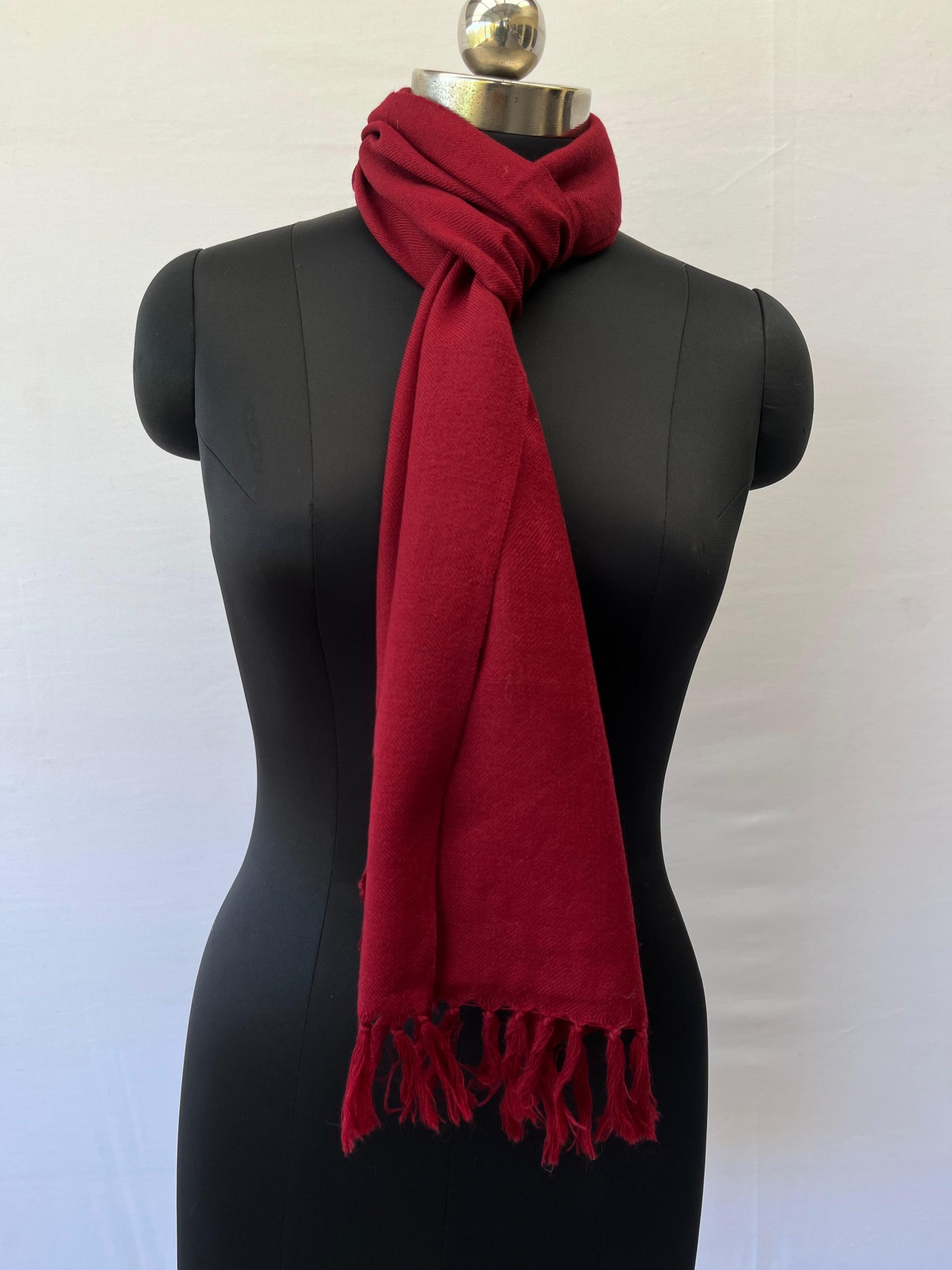 Classic red merino wool, handwoven scarf, knotted on a mannequin