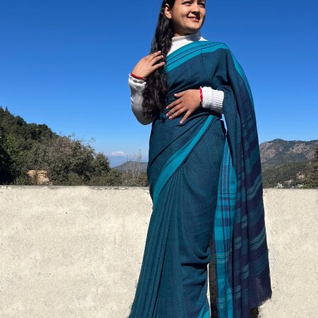 Handwoven azure blue merino wool saree, with a capri blue border