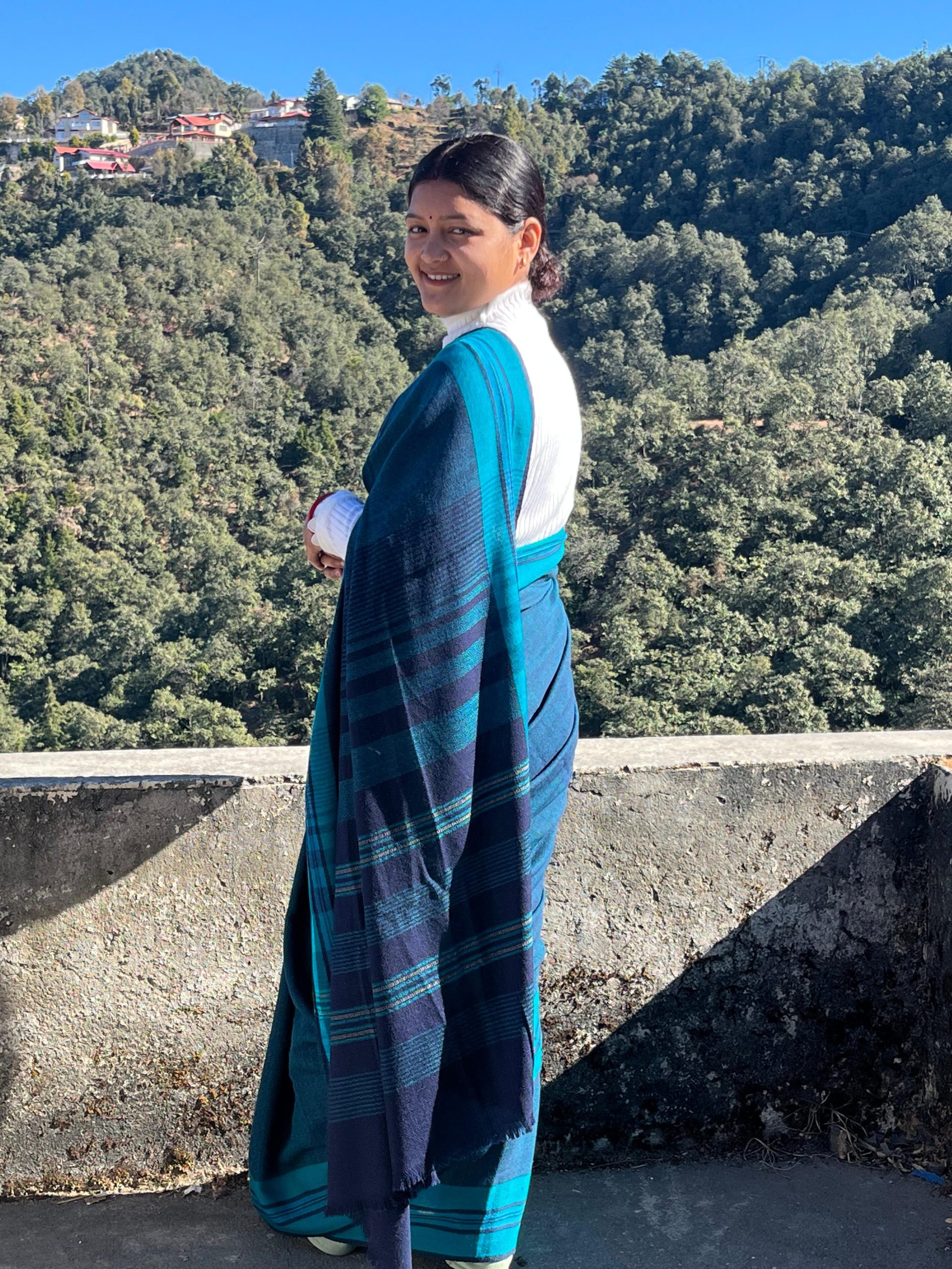 Handwoven azure blue merino wool saree, with a capri blue border