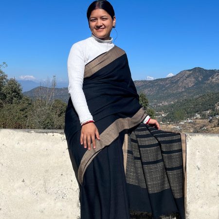 Handwoven merino wool saree in black with a caramel brown border.