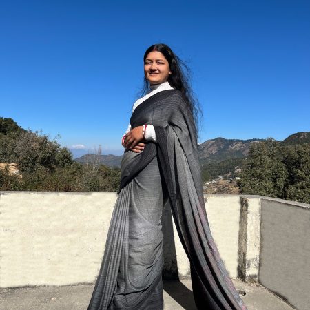 Handwoven merino wool saree in soft gradation of black and white, making it look like a soft charcoal gray. With subtle gradation of candy red in the palla.