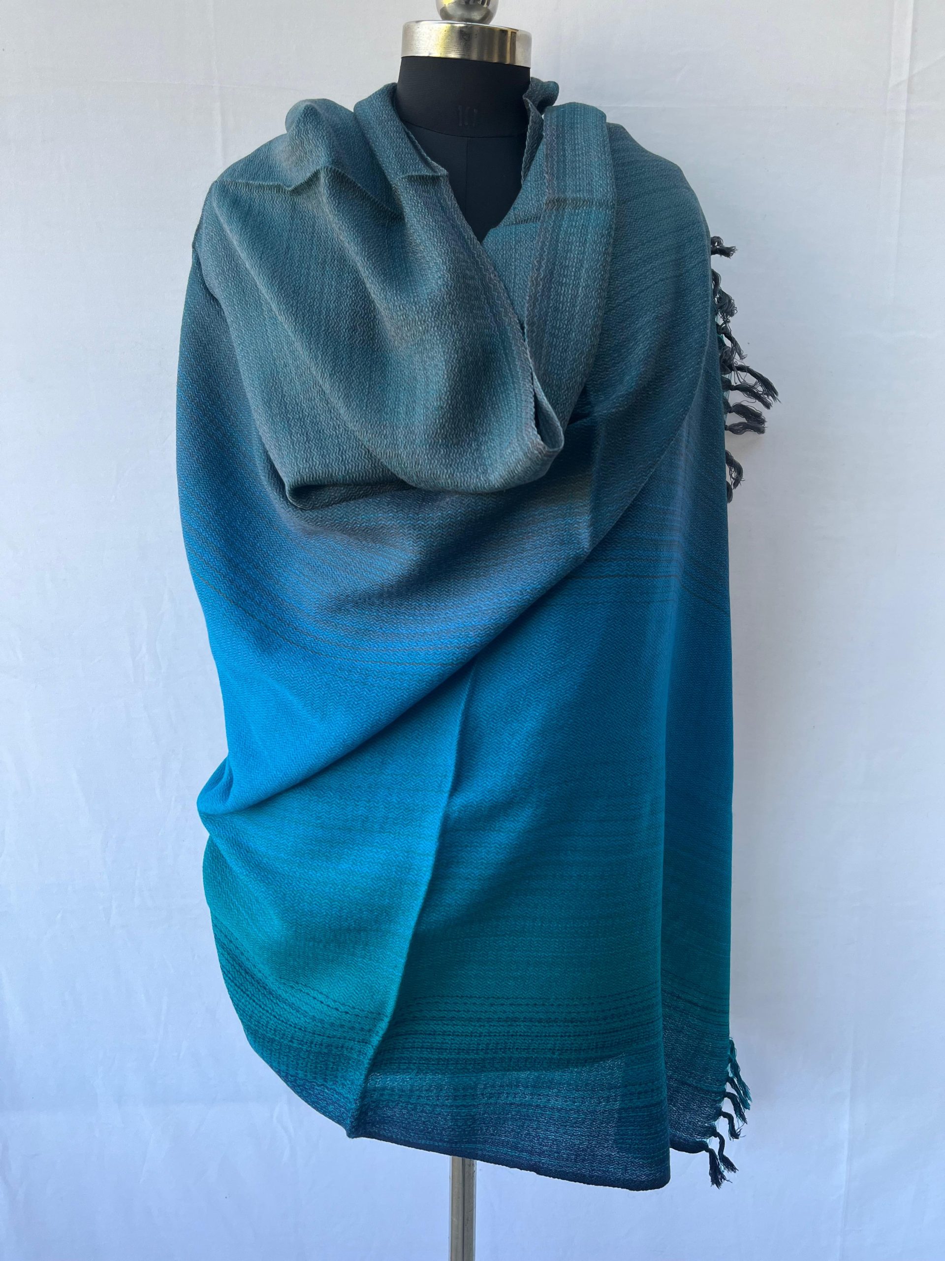 Handwoven merino wool shawl in ombre horizontal gradtion of oceanic blue, teal, turquoise and navy
