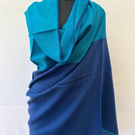 Handwoven merino wool shawl in two vertical stripes of baby blue and aegean blue