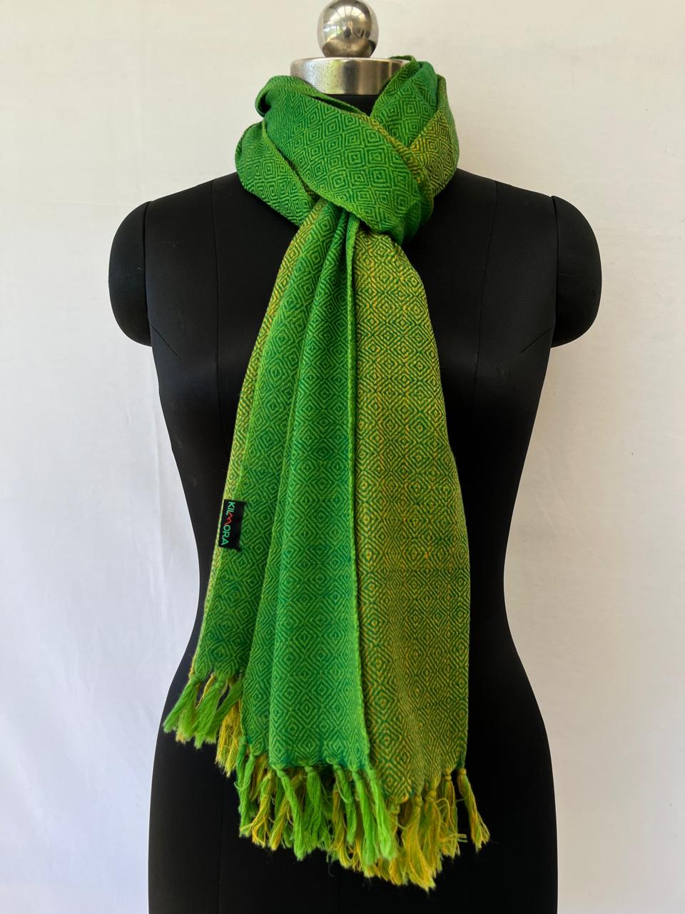 Hand-woven merino wool stole in lime green with a shamrock green broad edging with a diamond weave pattern.