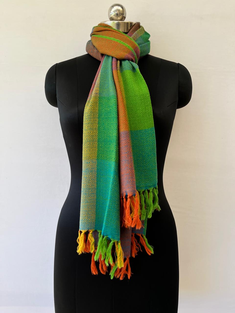Hand-woven merino wool stole in bold checks of brown, orange, yellow, shamrock green, parrot green with a weft of brown running throughout