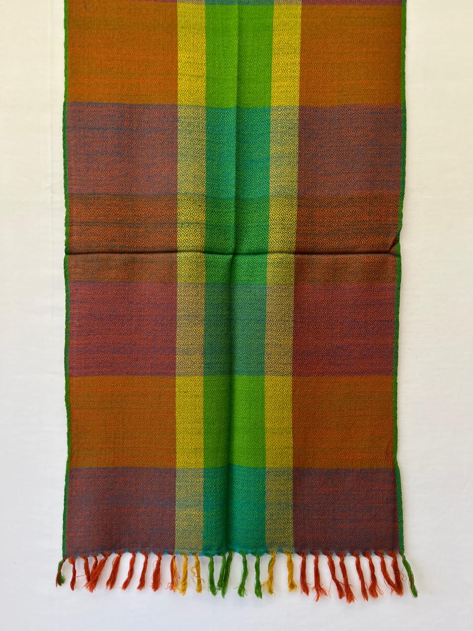 Hand-woven merino wool stole in bold checks of brown, orange, yellow, shamrock green, parrot green with a weft of brown running throughout