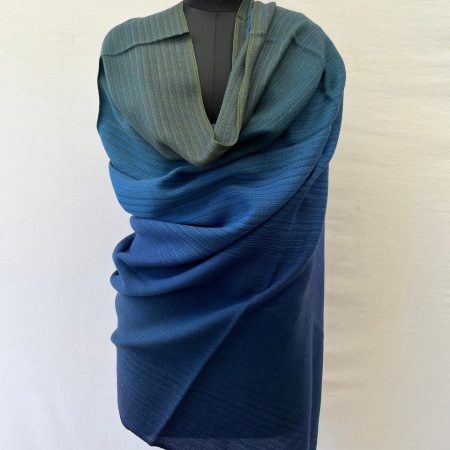 Hand-woven merino wool shawl in ombre weave with (from left to right) - blue green, indigo, cobalt and dark blue