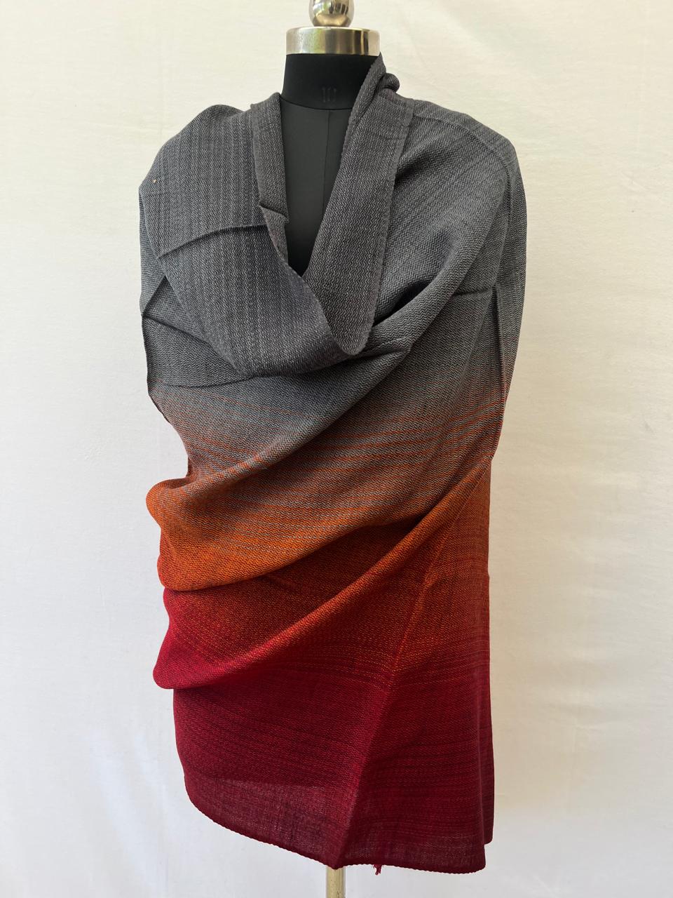 Hand-woven merino wool shawl in ombre weave with (from left to right) - warm gray, silver, orange and red