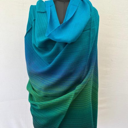 Hand-woven merino wool shawl in ombre weave with (from left to right) - bright blue, sky blue, cornflower blue. fern, shamrock and pine