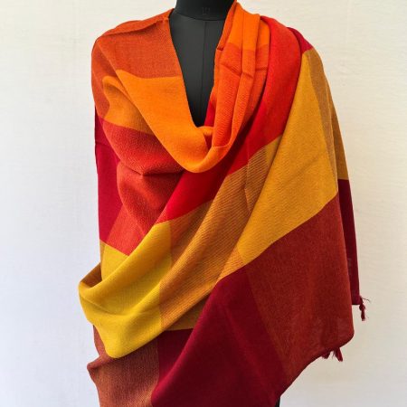 Hand-woven merino wool in large bold checks in autumn colours of crimson, candy, persimmon mahogany, ochre