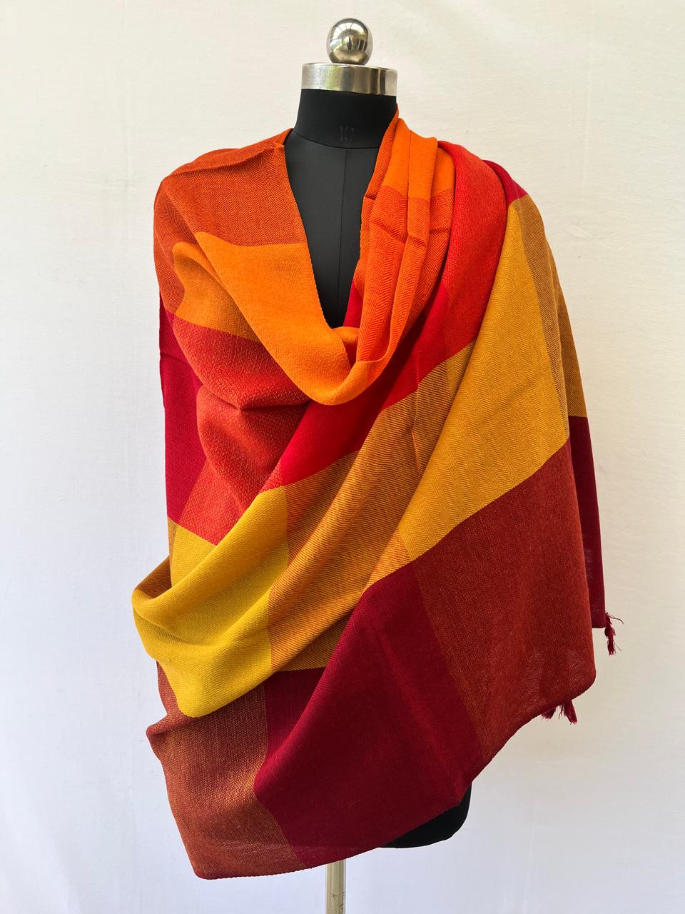 Hand-woven merino wool in large bold checks in autumn colours of crimson, candy, persimmon mahogany, ochre