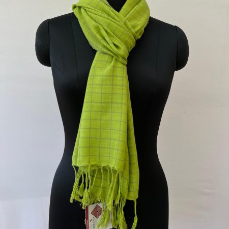 Hand woven cotton stole in lime green with small brown checks. Knotted on a mannequin.