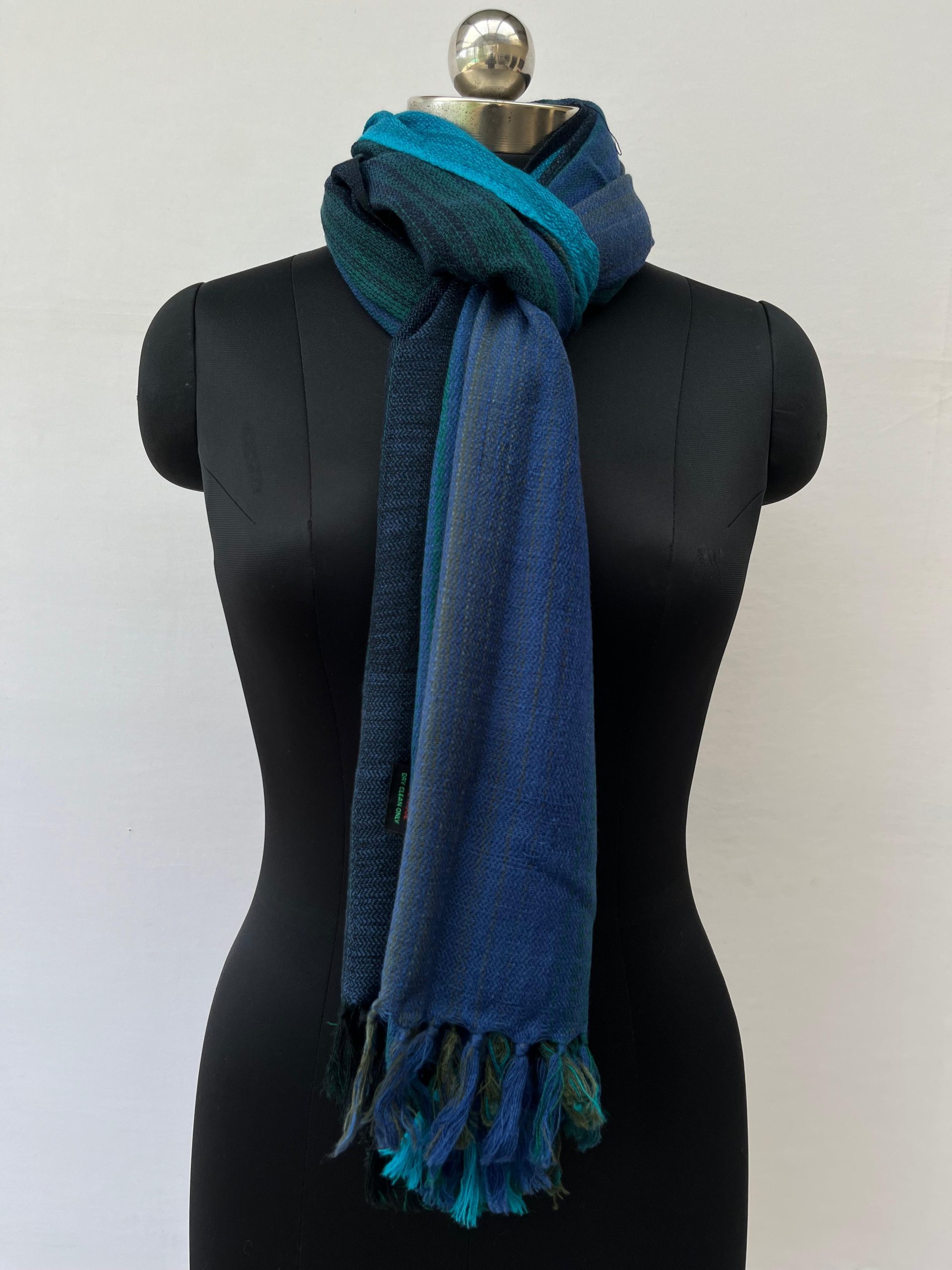 Ombre hand woven merino wool stole that starts with lapis blue, goes into deep pine green, navy and ends with a deep teal.