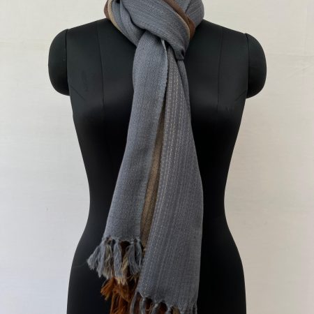 Ombre hand woven merino wool stole in mahogany, mocha, oat, and deep charcoal.