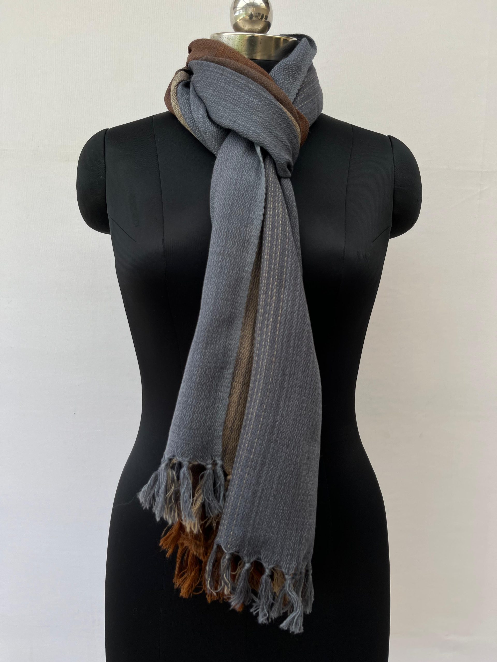 Ombre hand woven merino wool stole in mahogany, mocha, oat, and deep charcoal.