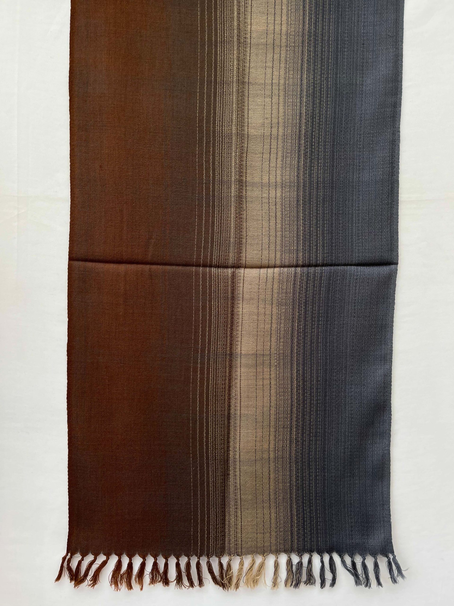 Ombre hand woven merino wool stole in mahogany, mocha, oat, and deep charcoal.