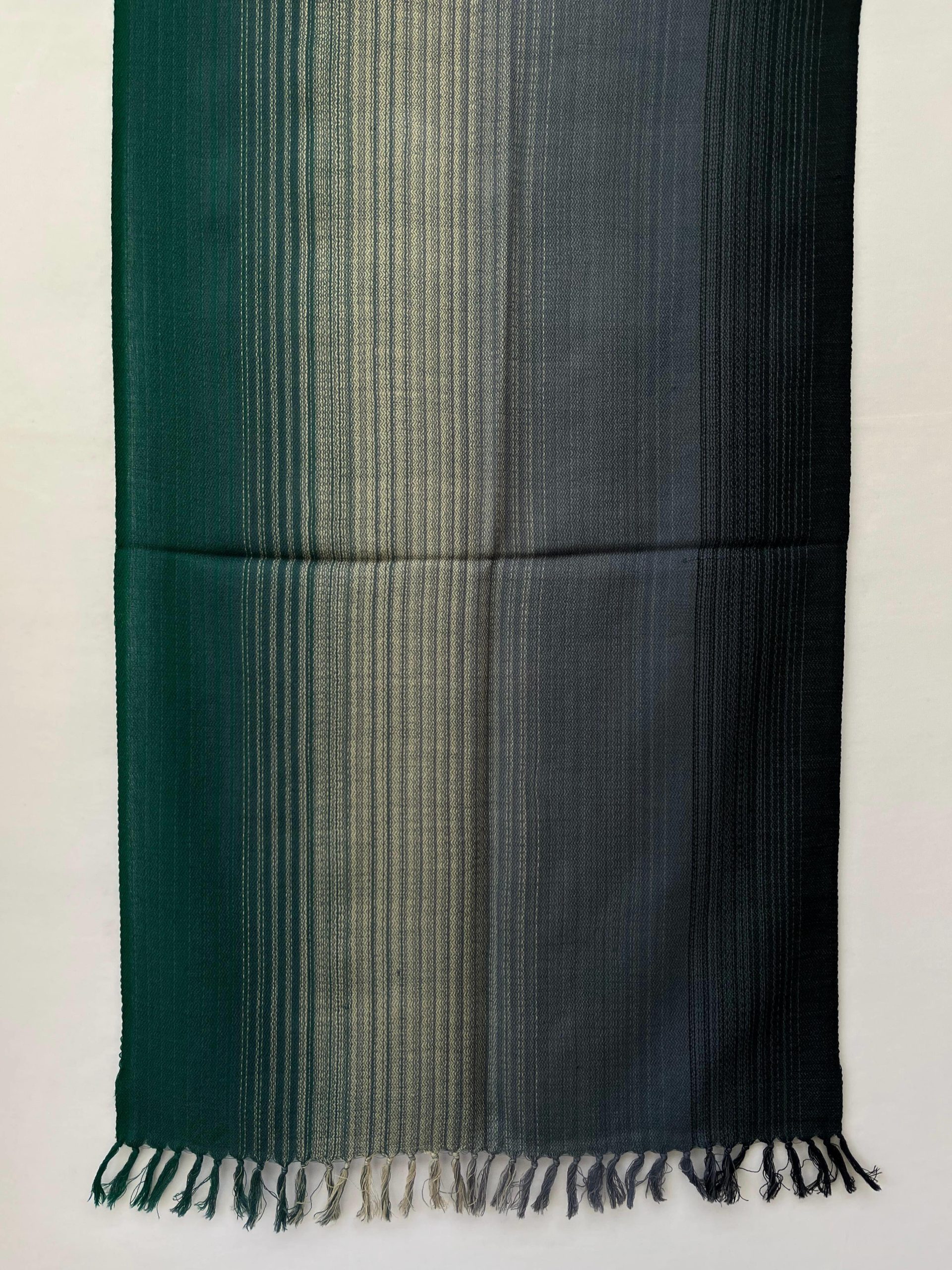Ombre hand woven merino wool stole in deep forest green, silver, and charcoal.