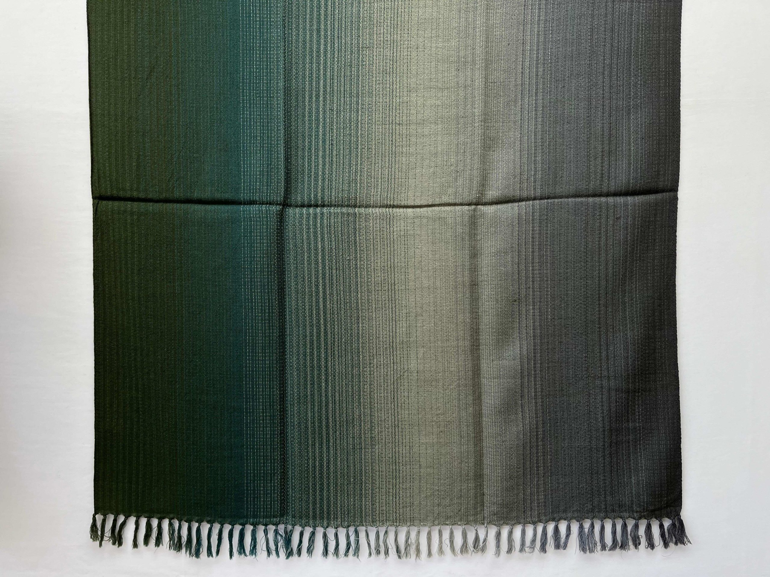 Hand woven merino wool ombre shawl in shades of deep pine green, moss green, solver and pewter