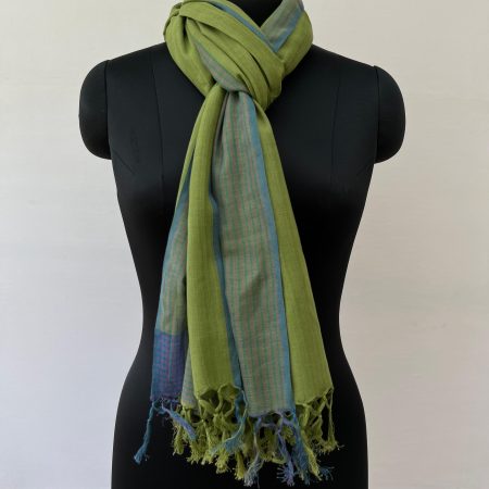 Hand woven cotton stole in spinach green with a navy blue graduated striped border on one vertical end. Knotted on a mannequin.