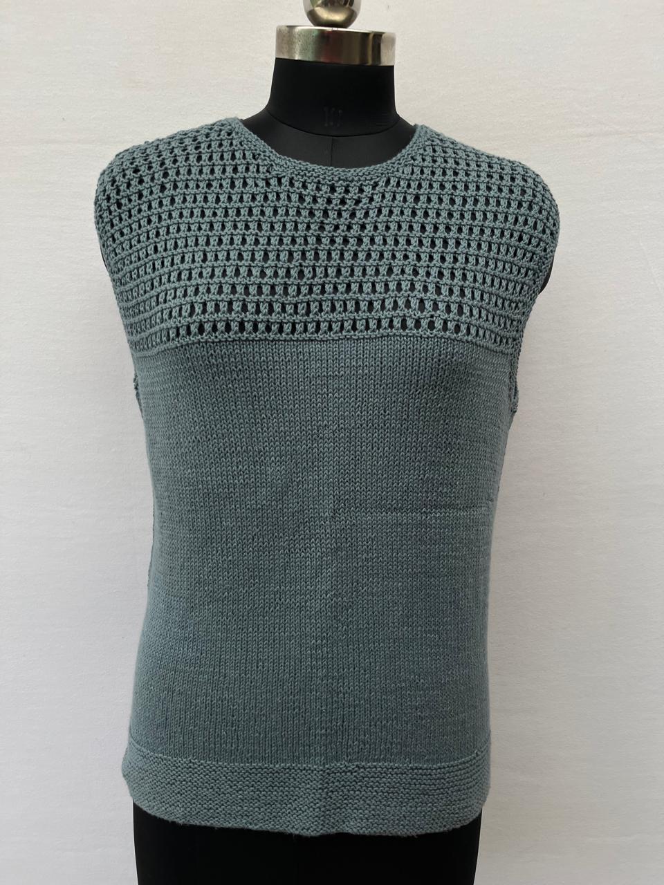 Mannequin is wearing a hand-knit cotton jaali top in misty gray