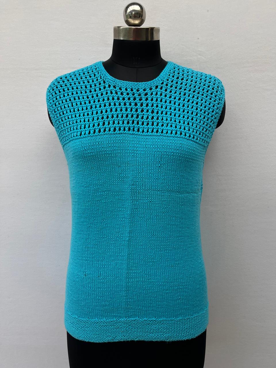 Mannequin is wearing a hand-knit cotton jaali top in sky blue