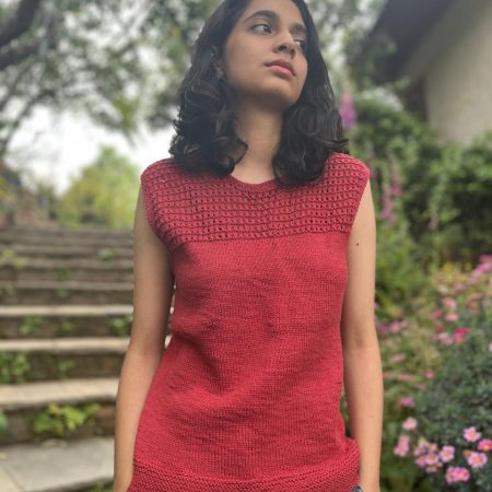 Model wearing a hand-knit cotton jaali top in crimson