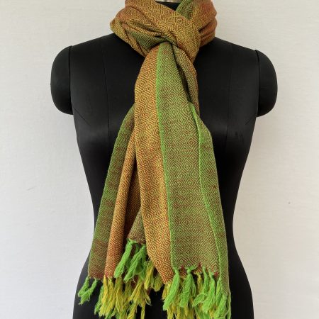 Hand-woven merino wool stole in mustard yellow with moss green border, and woven with a diamond weave.