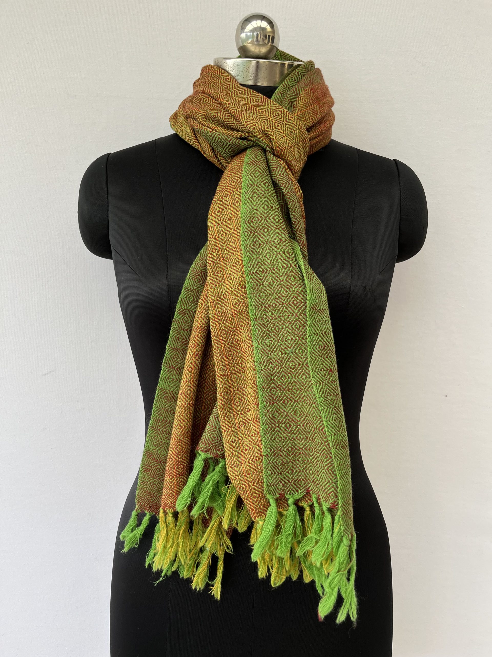 Hand-woven merino wool stole in mustard yellow with moss green border, and woven with a diamond weave.