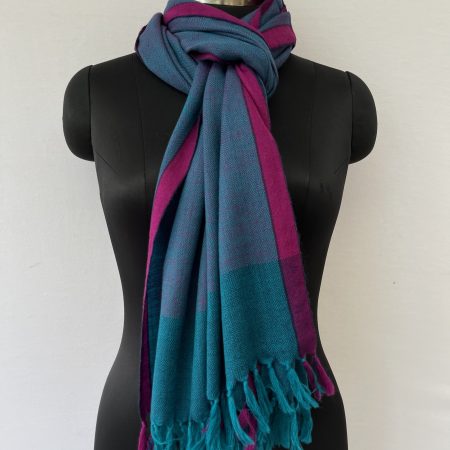 Aegean blue hand woven merino wool stole with a pink selvedge and weft.